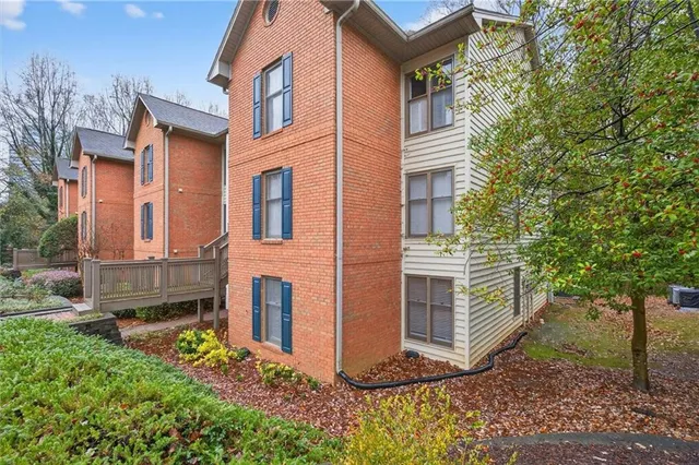 a view of a house with a yard and balcony