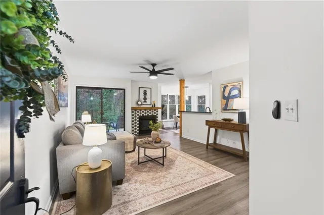 a living room with furniture and a fireplace