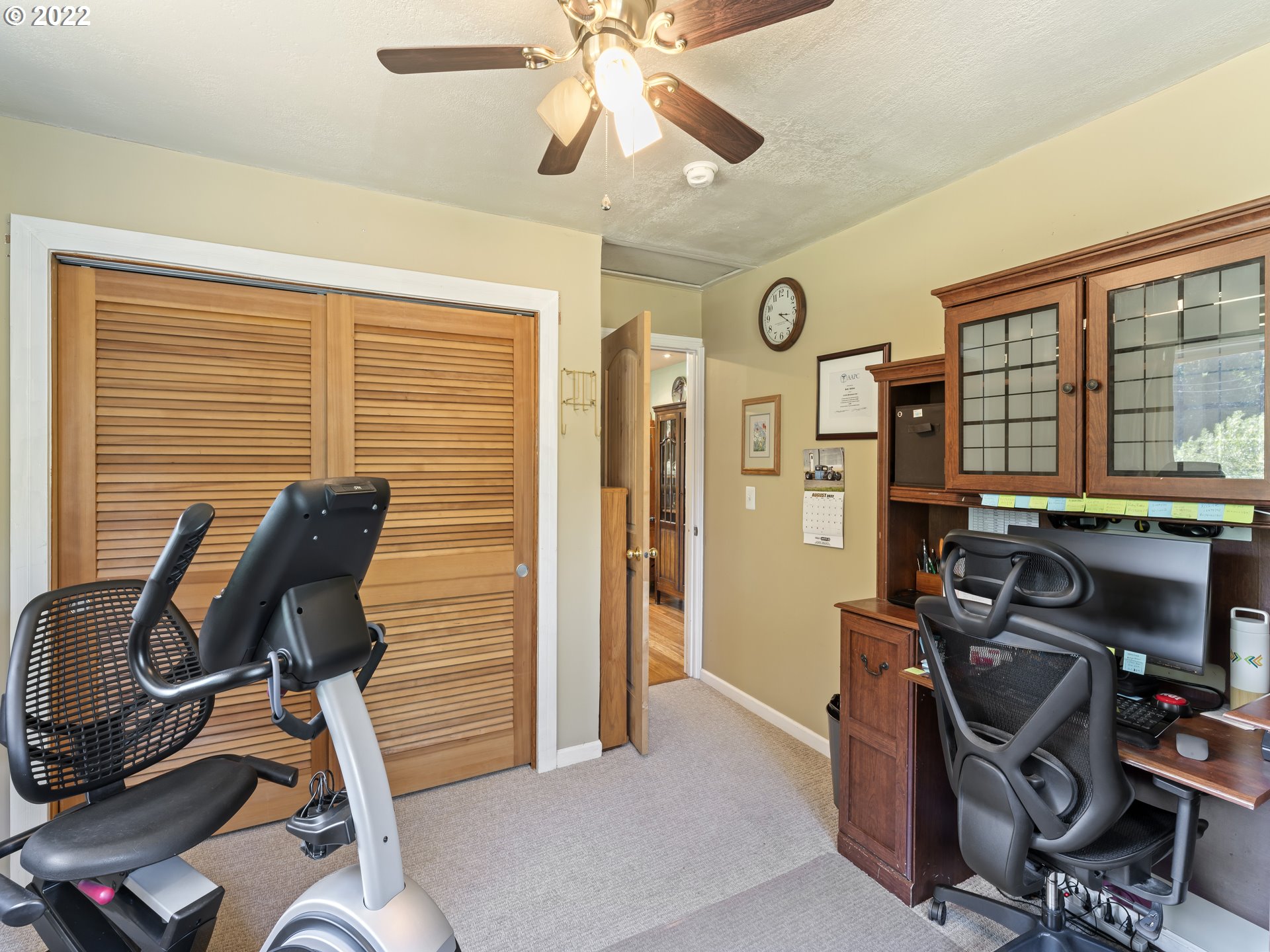 3530 Highway 38 Drain, OR 97435 - Photo 15 of 32 a view of workspace with wooden floor windows gym equipment and windows