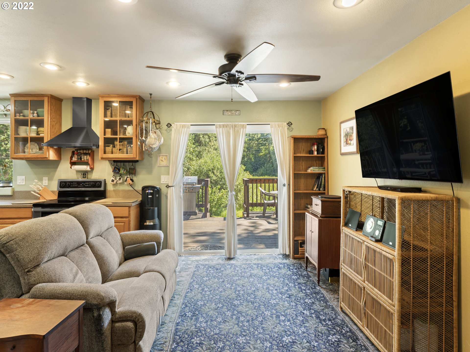 3530 Highway 38 Drain, OR 97435 - Photo 3 of 32 a living room with furniture and a flat screen tv