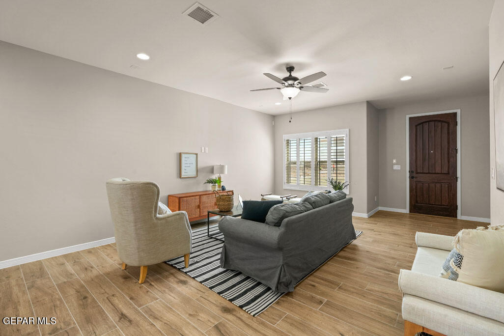 664 Paseo Musical Street El Paso, TX 79928 - Photo 13 of 50 a living room with furniture and wooden floor