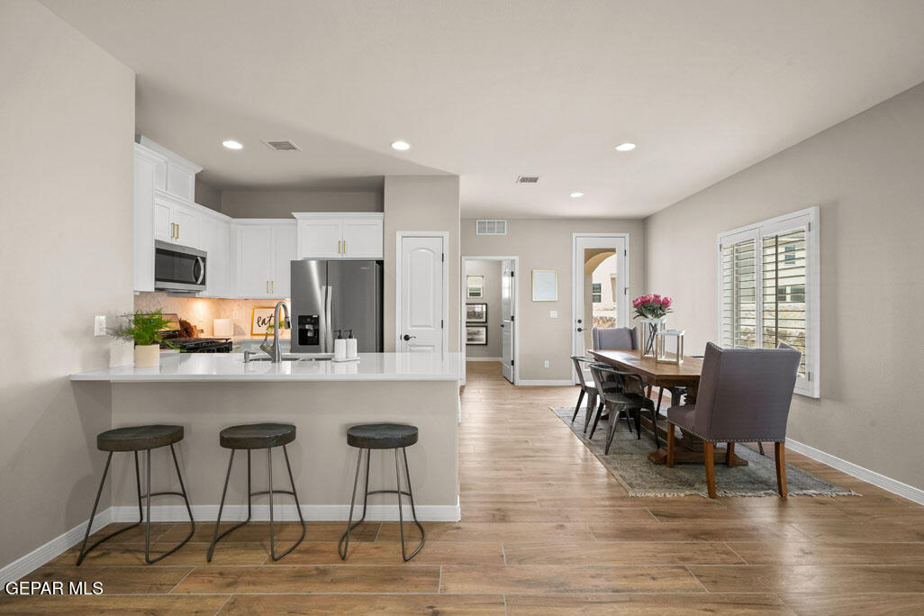 664 Paseo Musical Street El Paso, TX 79928 - Photo 15 of 50 a view of kitchen with cabinets table and chairs