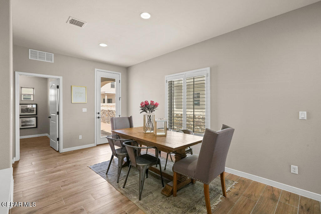 664 Paseo Musical Street El Paso, TX 79928 - Photo 19 of 50 a view of a dining room with furniture and window