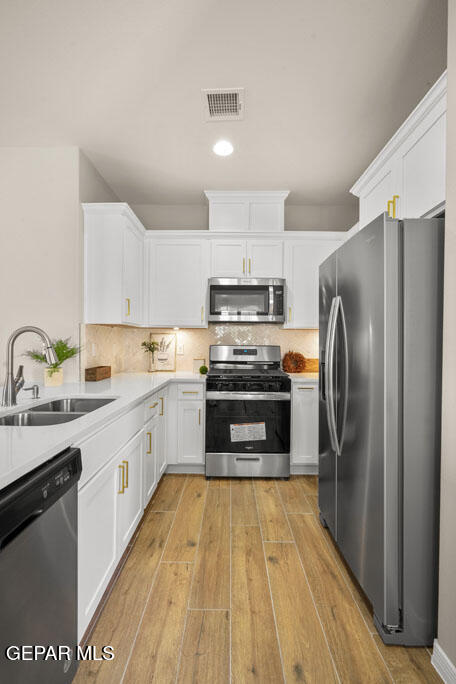 664 Paseo Musical Street El Paso, TX 79928 - Photo 24 of 50 a kitchen with granite countertop a refrigerator and a sink
