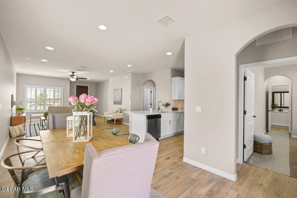 664 Paseo Musical Street El Paso, TX 79928 - Photo 27 of 50 a view of a dining room with furniture and wooden floor
