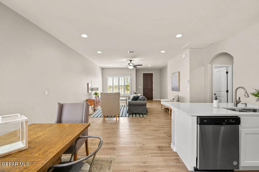 664 Paseo Musical Street El Paso, TX 79928 - Photo 28 of 50 a living room with dining room and wooden floor