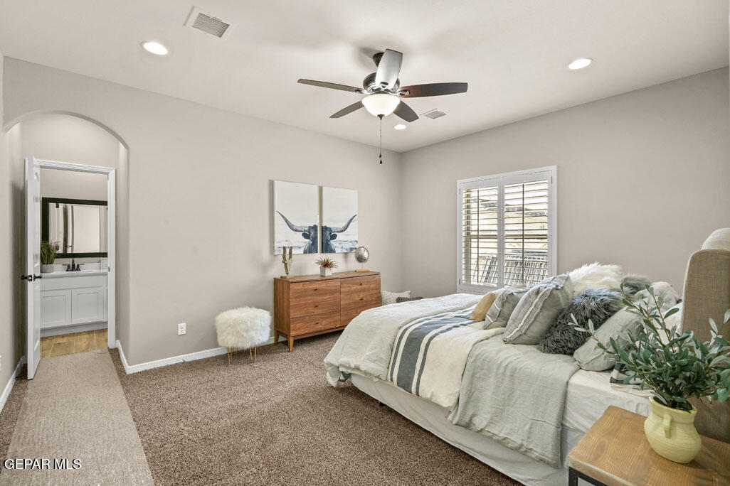 664 Paseo Musical Street El Paso, TX 79928 - Photo 30 of 50 a bedroom with a large bed and windows