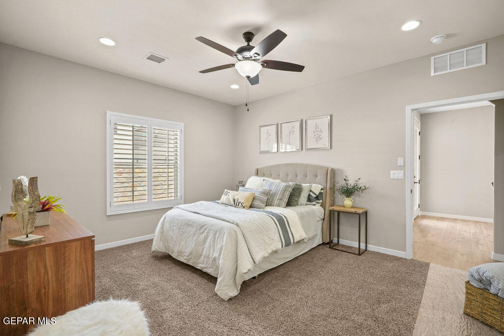 664 Paseo Musical Street El Paso, TX 79928 - Photo 31 of 50 a bedroom with a bed and a couch