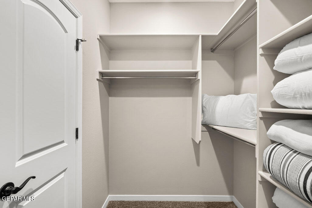 664 Paseo Musical Street El Paso, TX 79928 - Photo 40 of 50 a view of walk in closet with clothes and shoes
