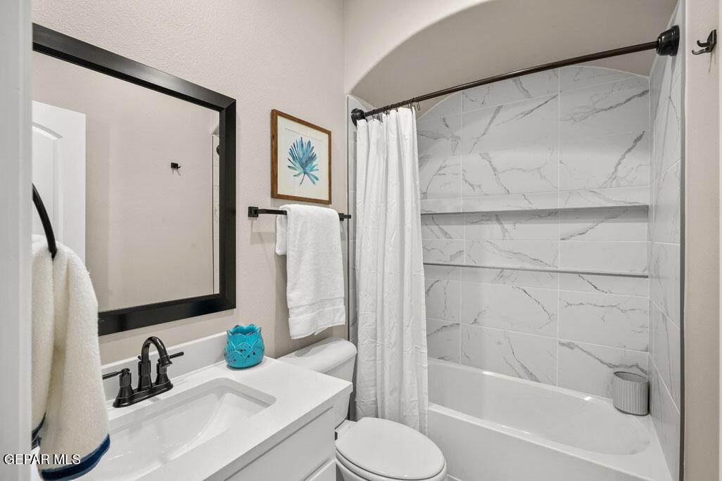 664 Paseo Musical Street El Paso, TX 79928 - Photo 42 of 50 a bathroom with a granite countertop sink toilet and shower
