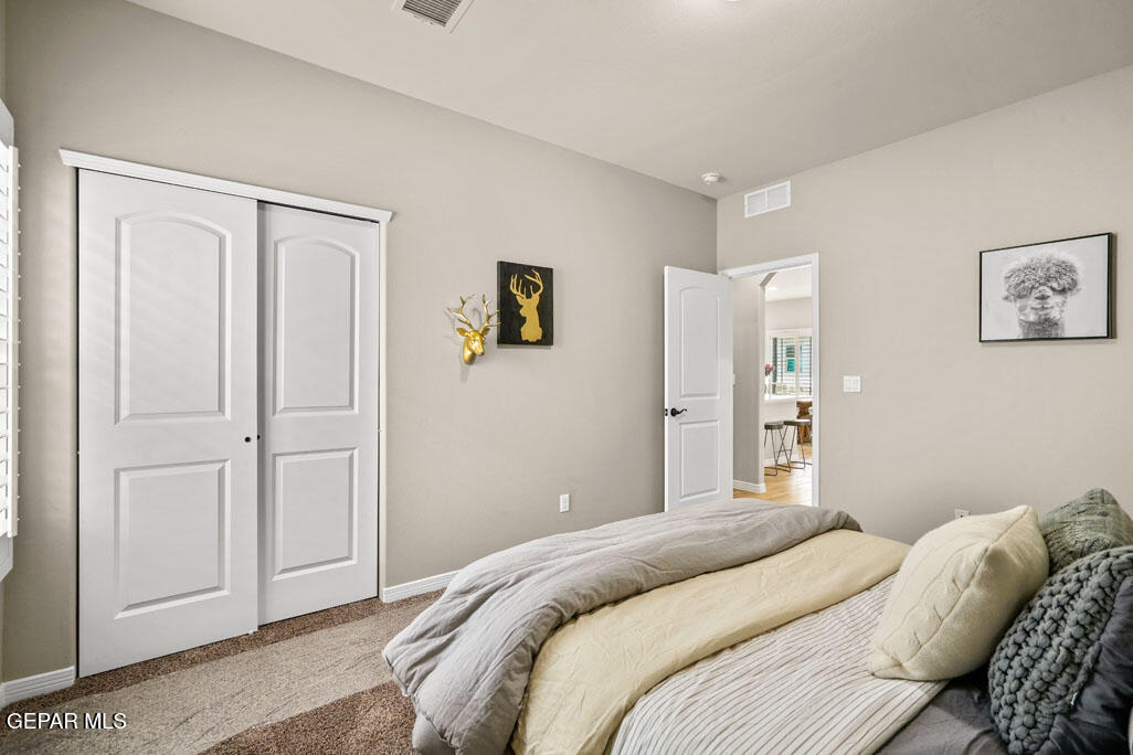 664 Paseo Musical Street El Paso, TX 79928 - Photo 45 of 50 a bedroom with a bed and painting on the wall