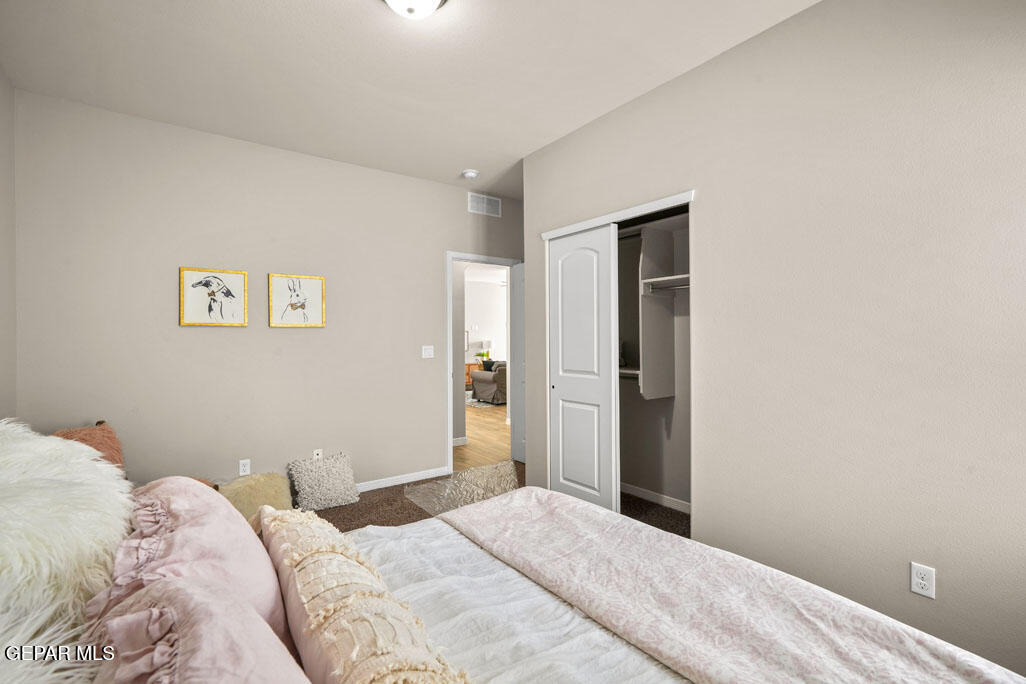 664 Paseo Musical Street El Paso, TX 79928 - Photo 47 of 50 a bedroom with a bed and a window