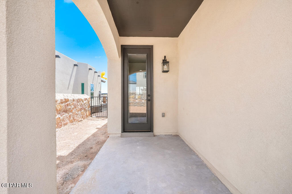 664 Paseo Musical Street El Paso, TX 79928 - Photo 50 of 50 a view of a hallway with wooden floor and a living room