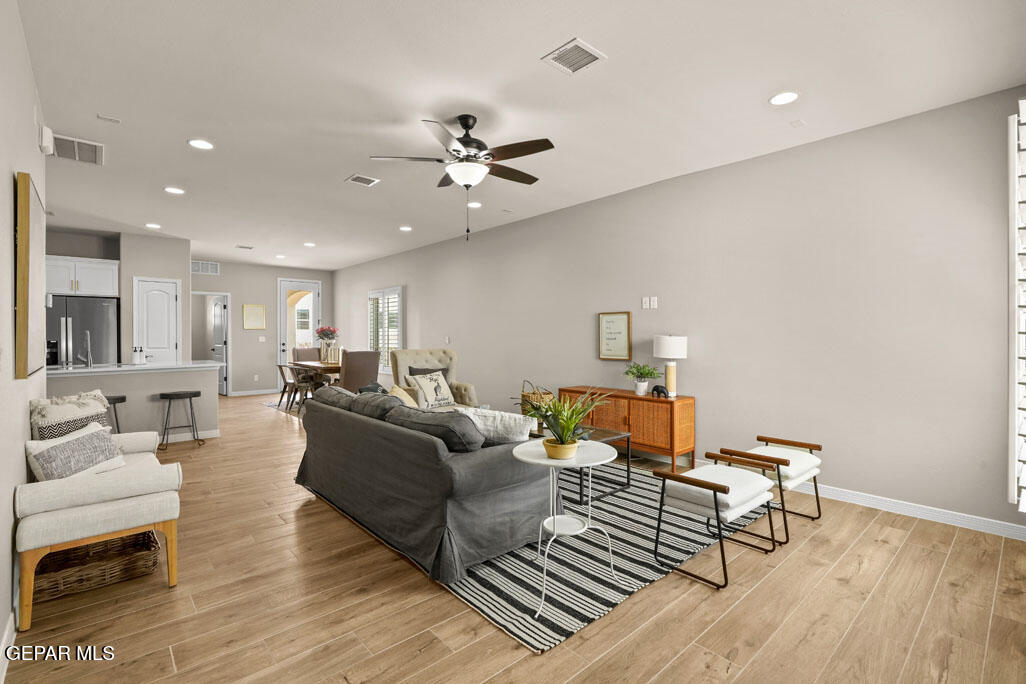 664 Paseo Musical Street El Paso, TX 79928 - Photo 7 of 50 a living room with furniture and a wooden floor