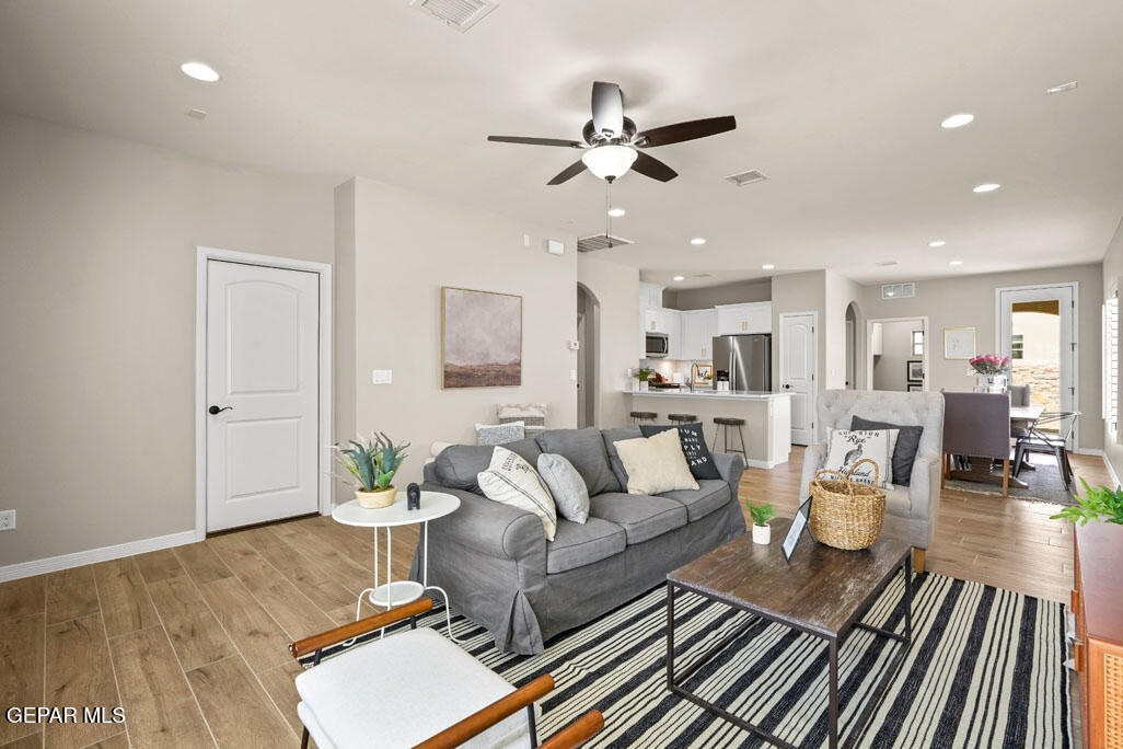 664 Paseo Musical Street El Paso, TX 79928 - Photo 9 of 50 a living room with furniture and kitchen view