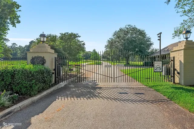 a view of a gate and fence