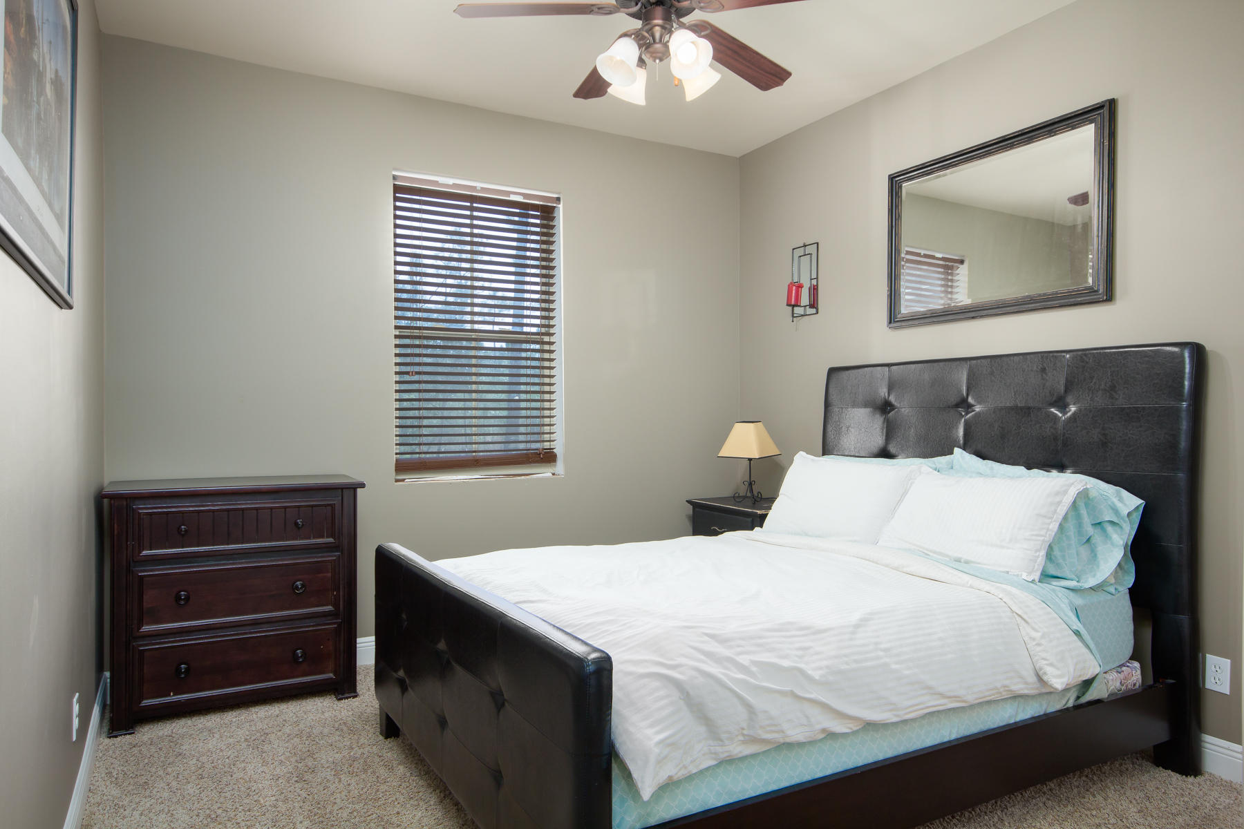 143 Pepper Tree Road Santa Rosa Beach, FL 32459 - Photo 21 of 28 a bedroom with a bed and a chandelier