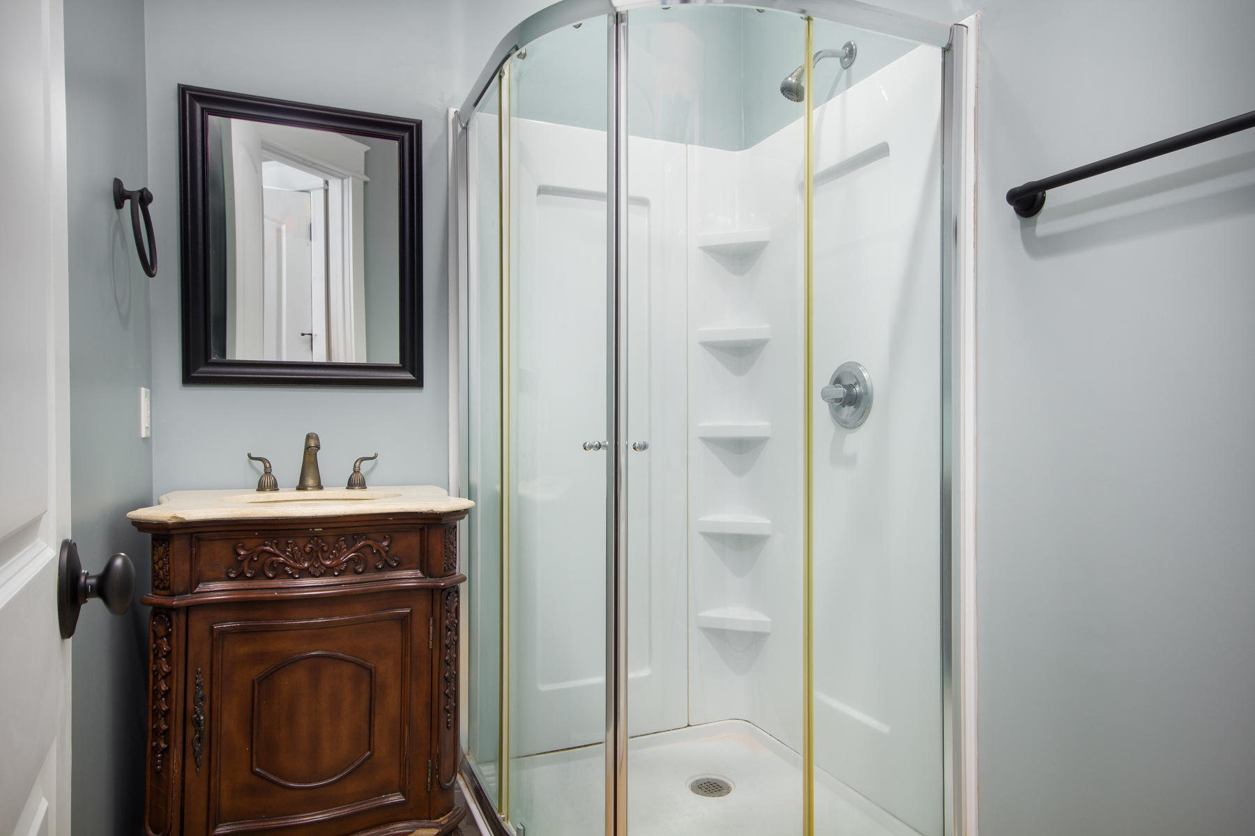 143 Pepper Tree Road Santa Rosa Beach, FL 32459 - Photo 22 of 28 a bathroom with a granite countertop sink a mirror and a shower