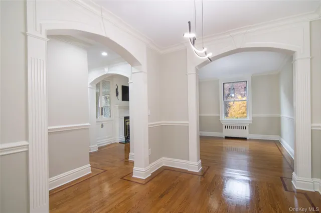 a view of livingroom with hardwood floor and hallway