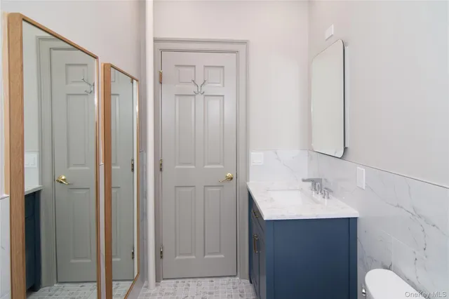 a bathroom with a sink and mirror