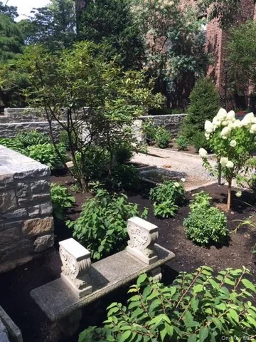 a view of a backyard with sitting area