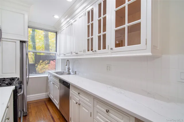 a kitchen with a sink and a window