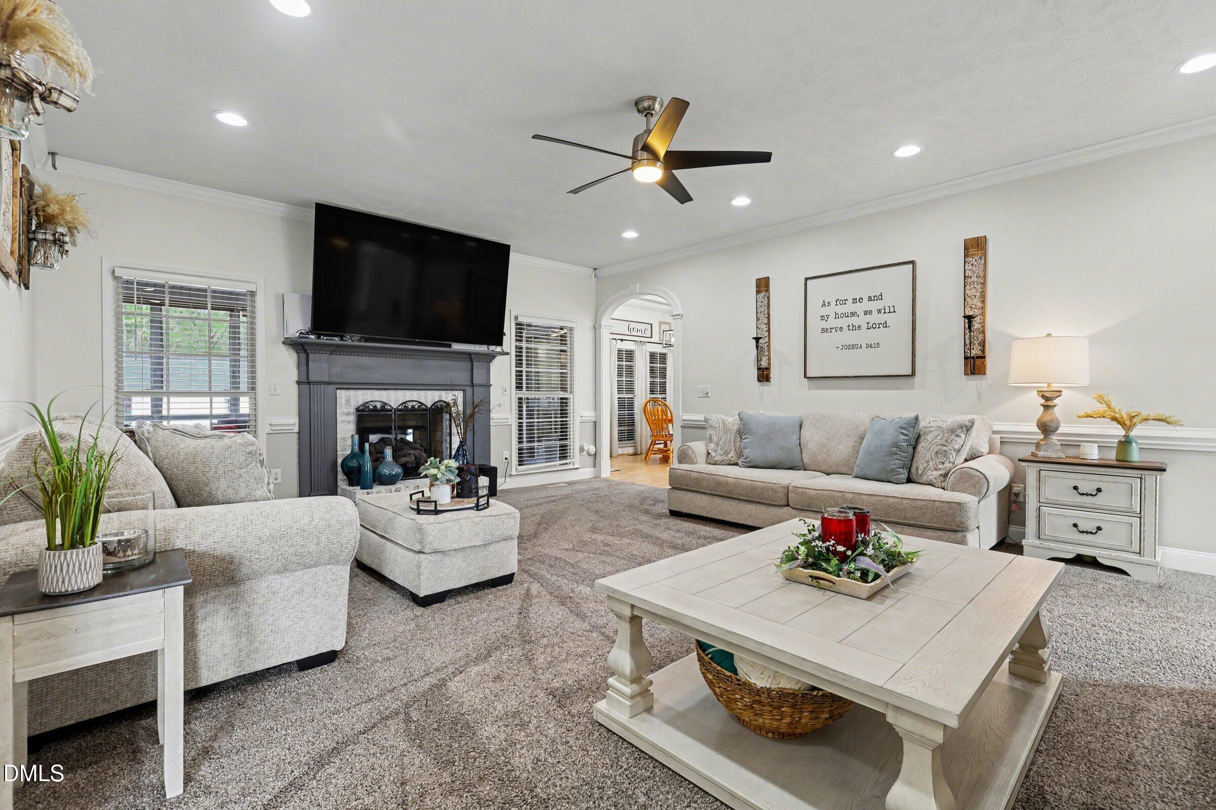 430 Fred Hall Road Stedman, NC 28391 - Photo 5 of 63 a living room with furniture fireplace and a flat screen tv