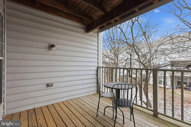 a view of a balcony with furniture