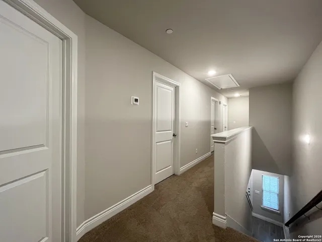 a view of a hallway with a furniture