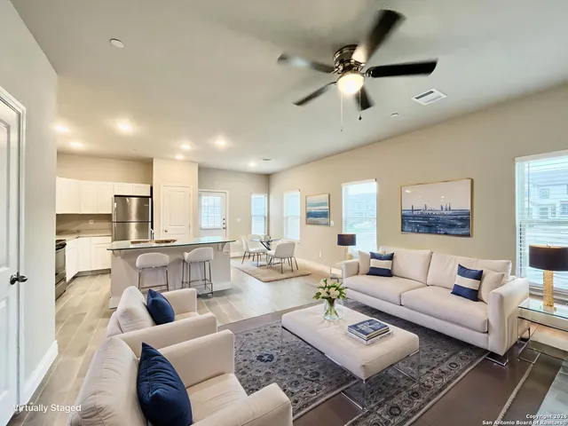 a living room with furniture and a large window