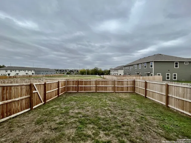 a view of a big room with wooden fence