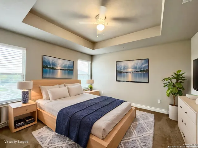 a bedroom with a bed and a potted plant