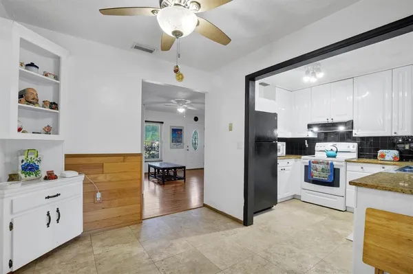 a view of kitchen with cabinet and cabinet