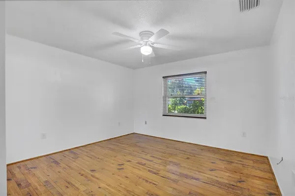 a bathroom with a sink a toilet a mirror and shower