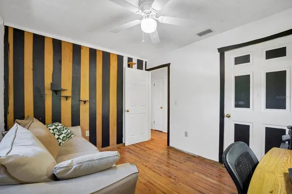 a utility room with dryer washer and a view of living area