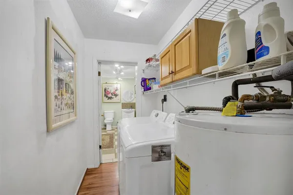 a bathroom with a toilet sink and shower
