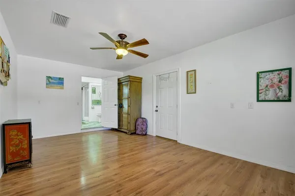 a view of a chair and table in the backyard