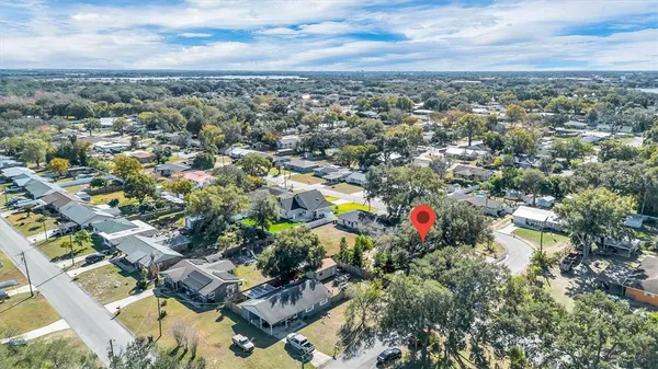 an aerial view of residential houses with outdoor space