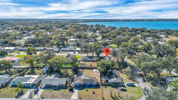 an aerial view of residential houses with city view