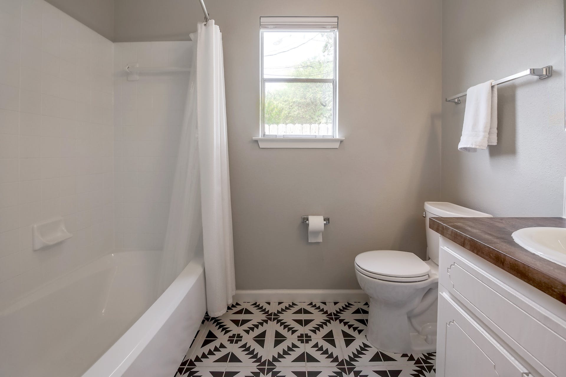 11118 Wandering Way, Unit A Austin, TX 78754 - Photo 20 of 29 a bathroom with a sink toilet and shower