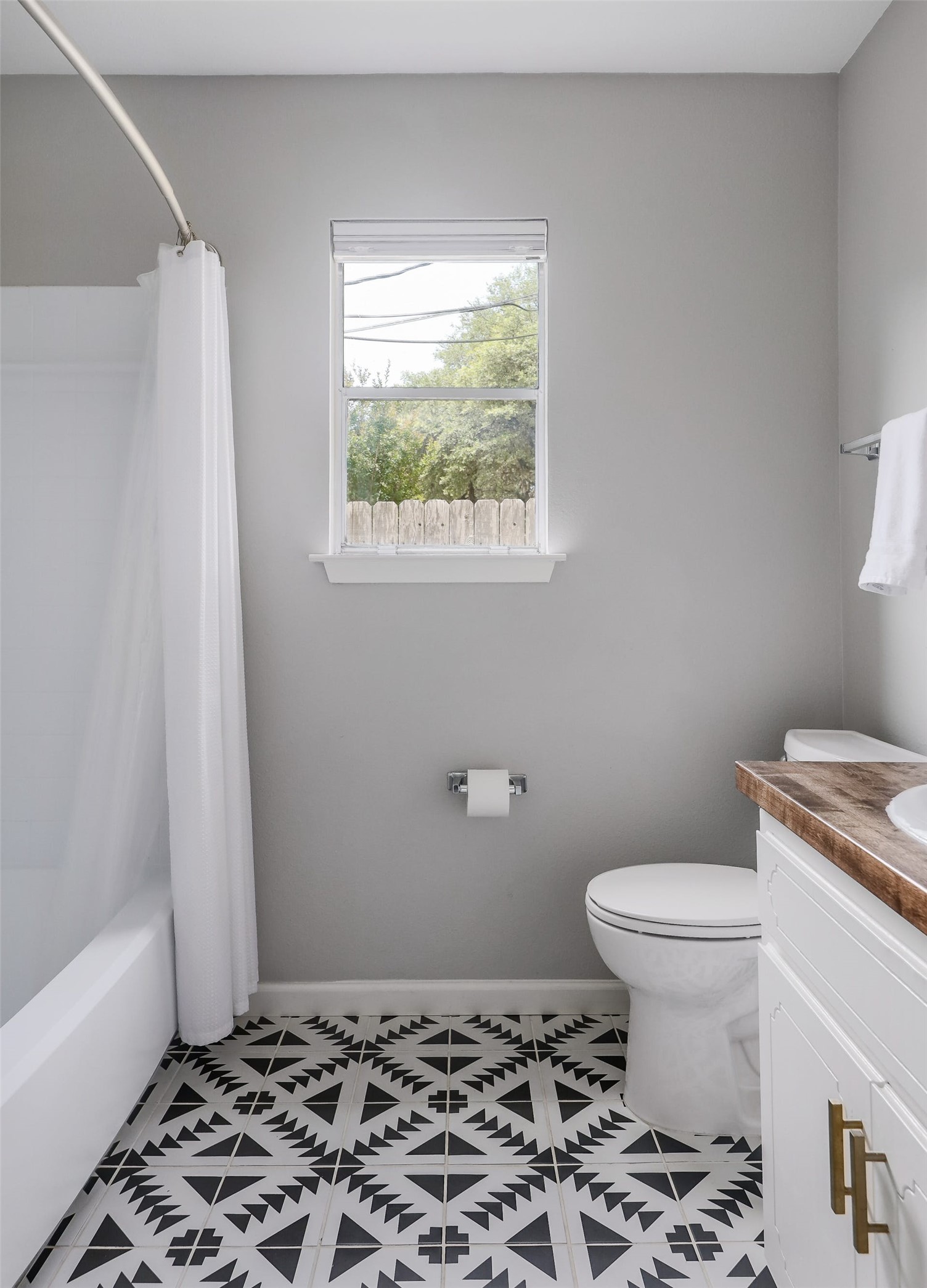 11118 Wandering Way, Unit A Austin, TX 78754 - Photo 21 of 29 a bathroom with a sink toilet and window