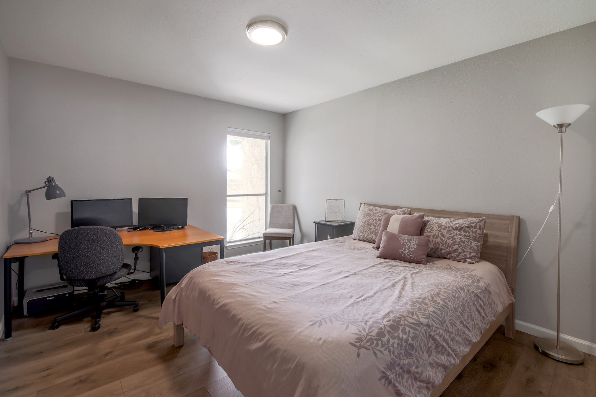 11118 Wandering Way, Unit A Austin, TX 78754 - Photo 24 of 29 a bedroom with bed and window