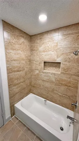 a bathroom with a bathtub