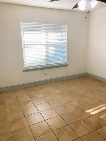 a view of a room that has a window in it