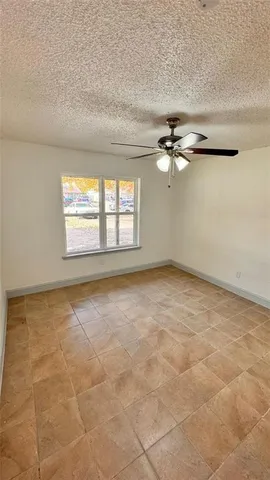 a view of an empty room and a window