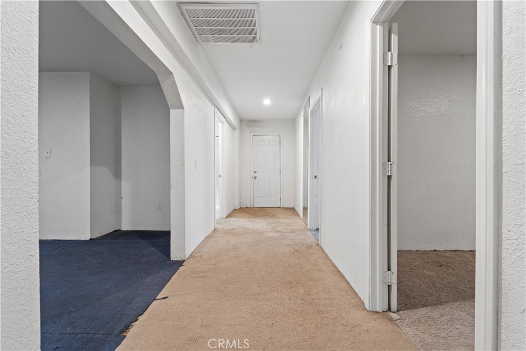 32900 Dune Road Newberry Springs, CA 92365 - Photo 17 of 40 en view of a hallway with wooden floor