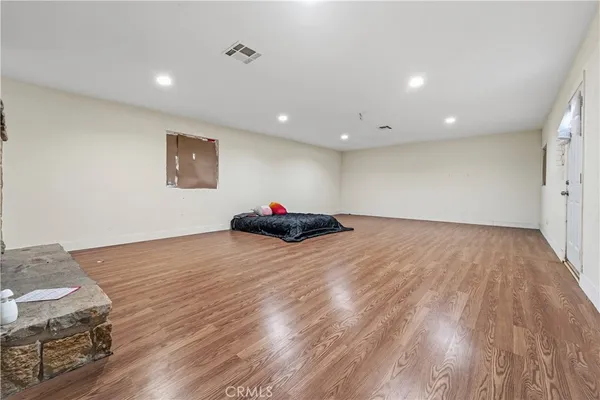 a very nice looking room with wooden floor
