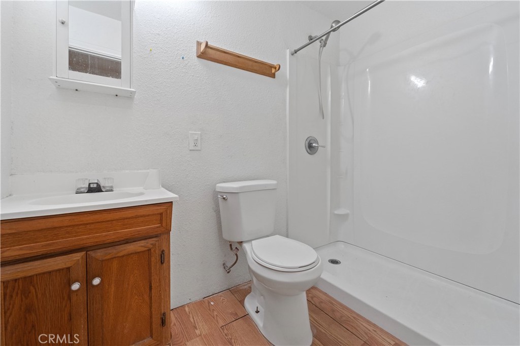 32900 Dune Road Newberry Springs, CA 92365 - Photo 22 of 40 a bathroom with a sink a toilet and shower