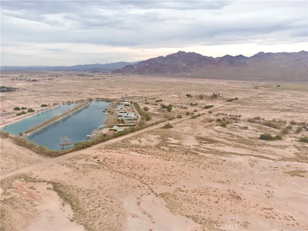 a view of a yard with snow on the road