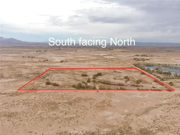 a view of ocean with a big yard